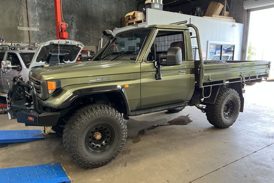 A modified Toyota LandCruiser ute on the floor of the Ken Day's Automotive Services workshop
